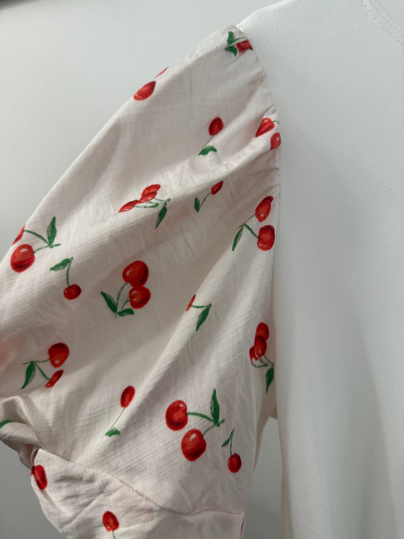 The Pink Door Cherry Print Pouf Sleeve Top White