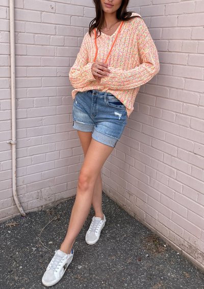 The Pink Door Distressed Raw Edge Denim Shorts - Light Wash