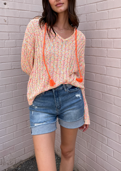 The Pink Door Distressed Raw Edge Denim Shorts - Light Wash