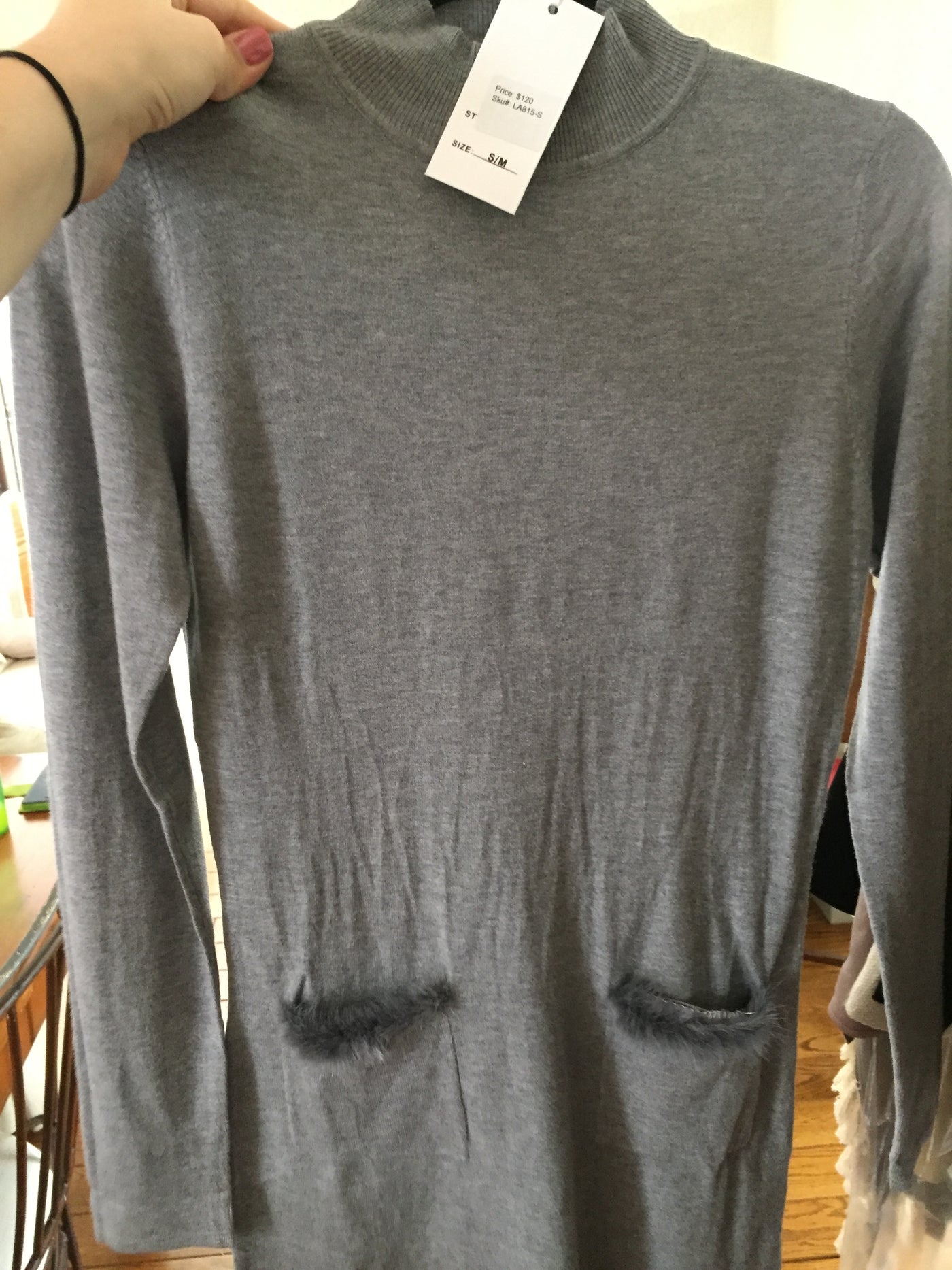 Grey sweater with fur trim pockets