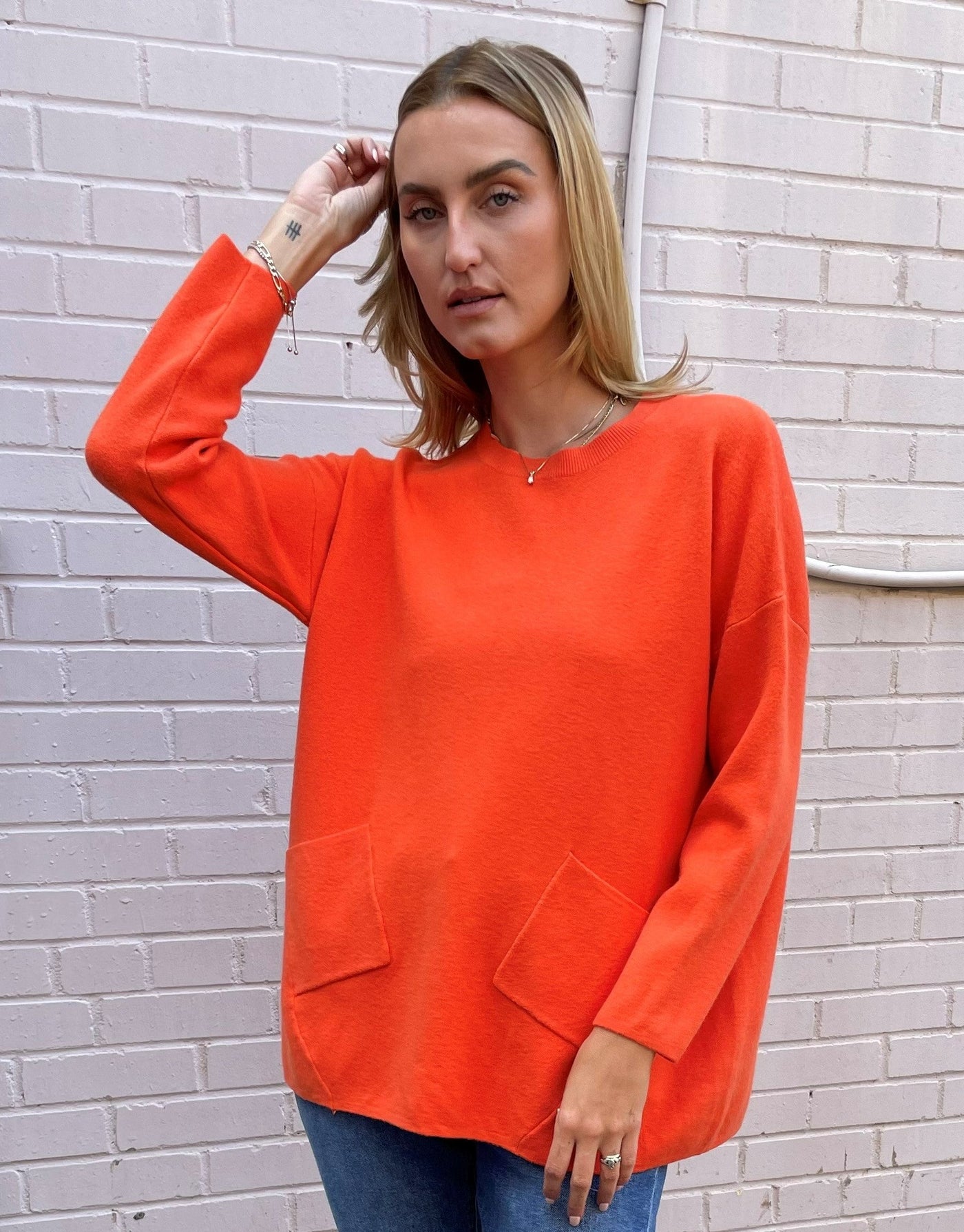 The Pink Door Orange Knit Sweater with Pockets